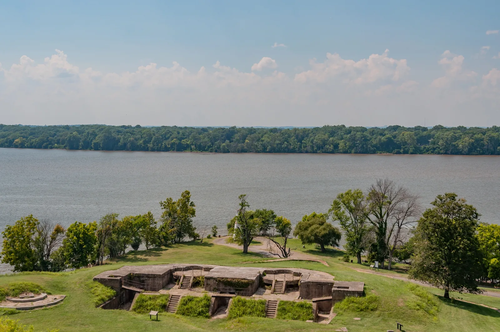 Historic stone fortifications overlooking the Potomac River along lush Maryland hillsides.